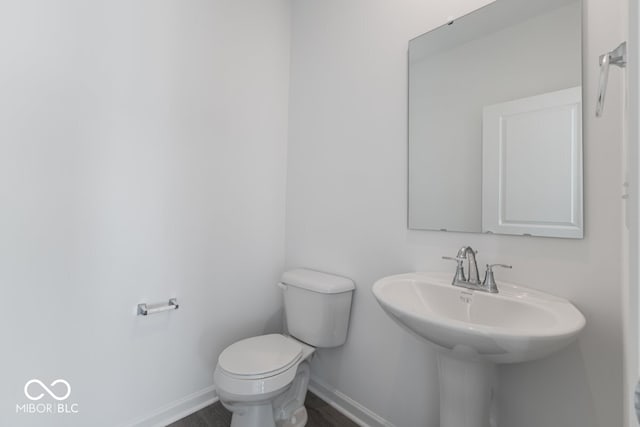 bathroom featuring sink and toilet