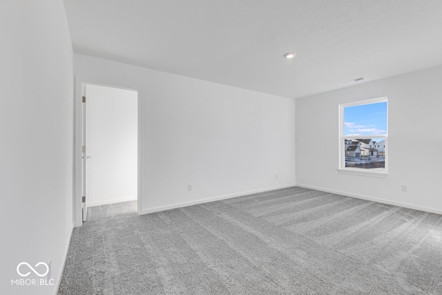 unfurnished room featuring carpet flooring