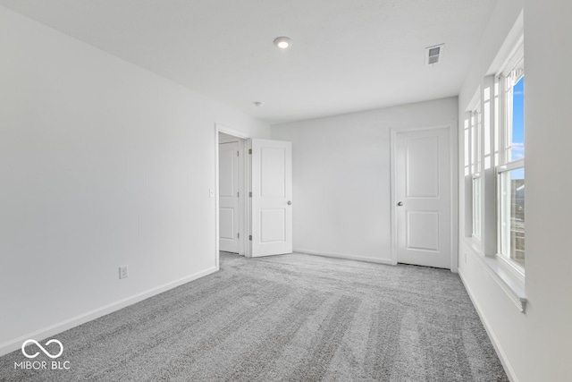 unfurnished room featuring carpet flooring