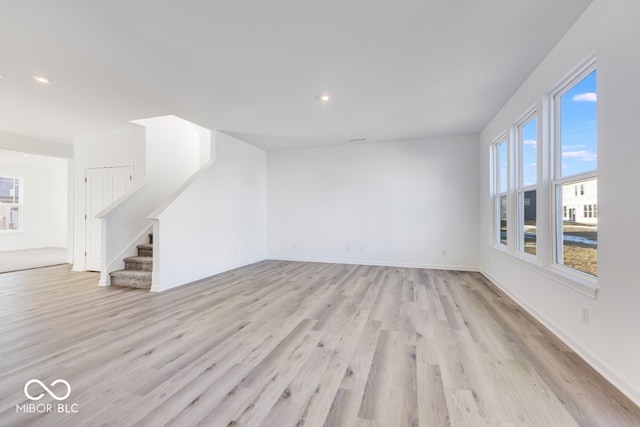 unfurnished living room with light hardwood / wood-style floors