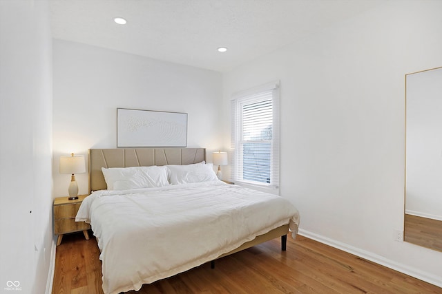 bedroom featuring wood-type flooring