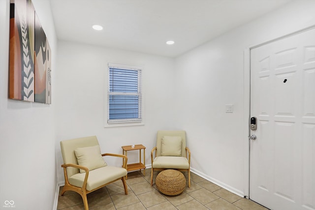 sitting room with light tile patterned floors