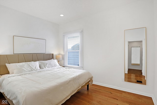 bedroom featuring hardwood / wood-style flooring