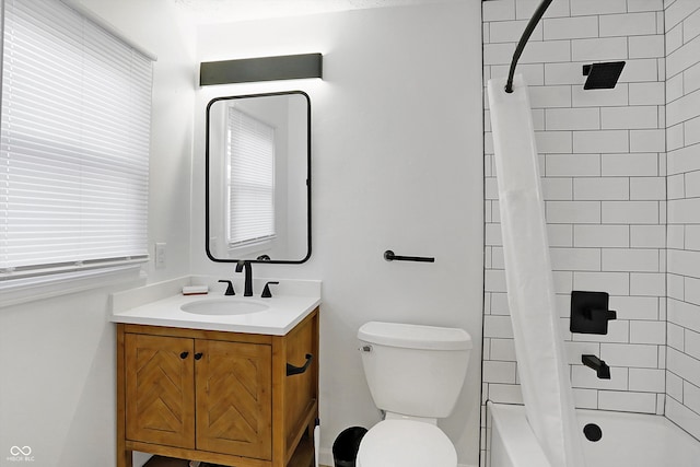 full bathroom with vanity, shower / bath combo with shower curtain, and toilet