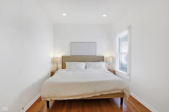 bedroom featuring hardwood / wood-style flooring