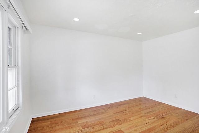 unfurnished room featuring light hardwood / wood-style floors