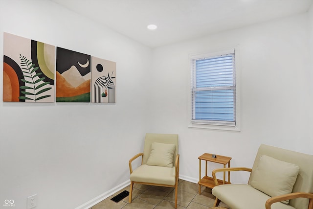 sitting room with tile patterned floors