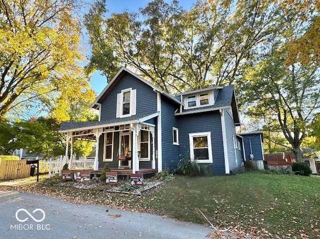 front facade featuring a front lawn and a porch