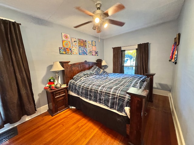 bedroom featuring light hardwood / wood-style floors and ceiling fan