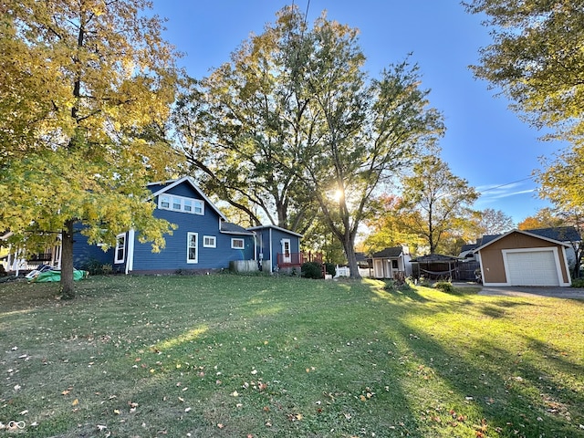 view of yard with a storage unit and a garage