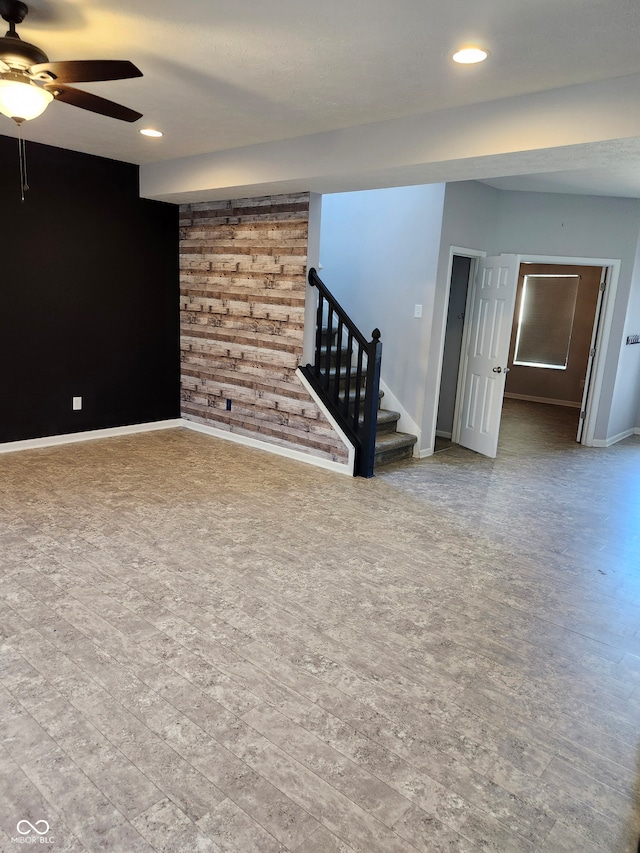 basement featuring ceiling fan and hardwood / wood-style floors