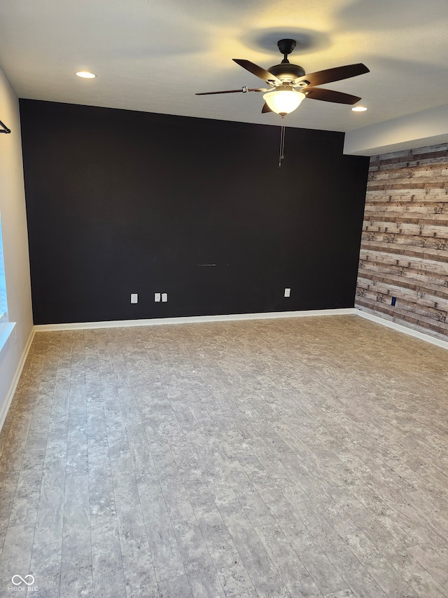 empty room featuring light hardwood / wood-style flooring and ceiling fan