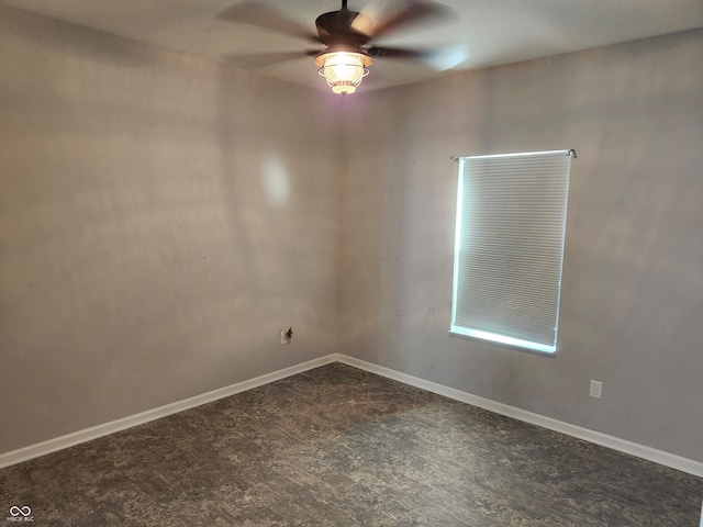 unfurnished room featuring dark hardwood / wood-style floors and ceiling fan