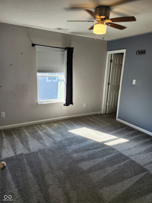 carpeted empty room with ceiling fan