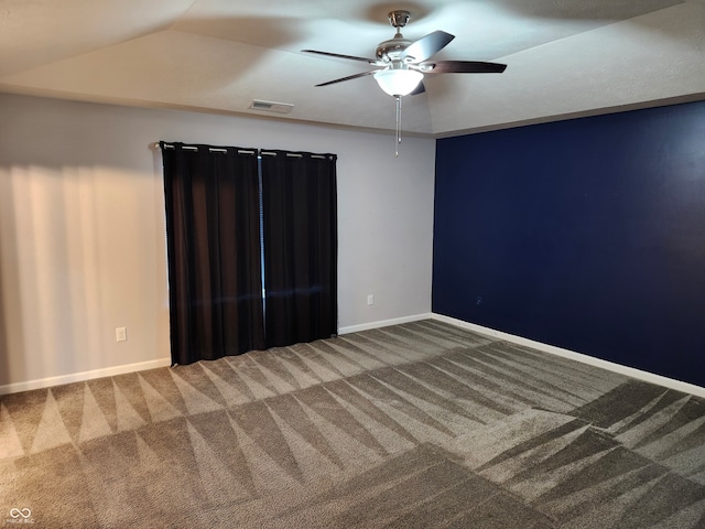 unfurnished room featuring vaulted ceiling, carpet floors, and ceiling fan