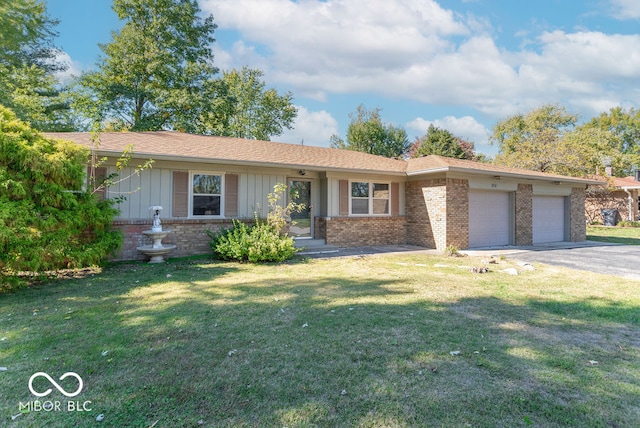 single story home featuring a front yard and a garage