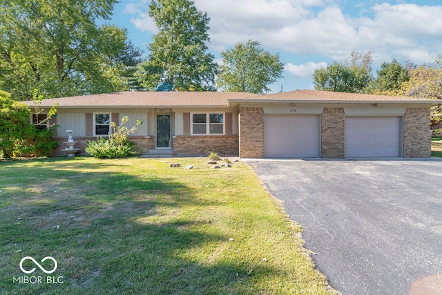 single story home featuring a garage and a front lawn