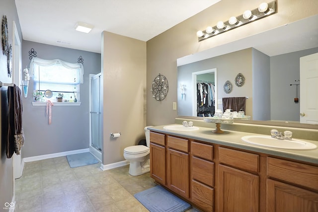 bathroom featuring vanity and a shower with shower door