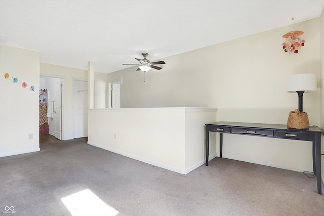 carpeted empty room with ceiling fan