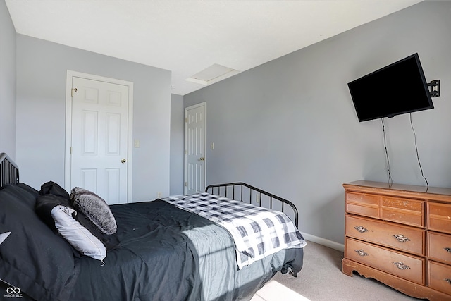 bedroom featuring light colored carpet