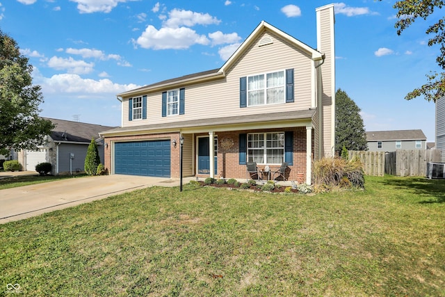 view of property with a garage, a front lawn, and covered porch