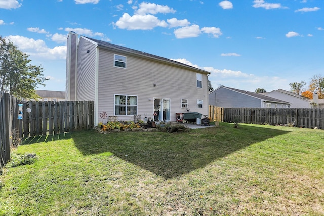 back of property featuring a yard and a patio area