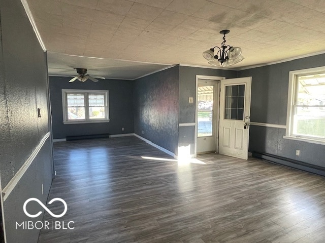 foyer entrance featuring crown molding, a healthy amount of sunlight, and dark hardwood / wood-style floors