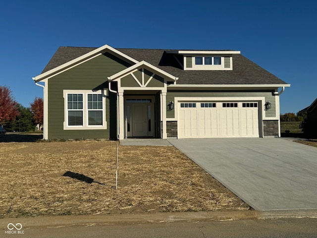 craftsman house with a garage