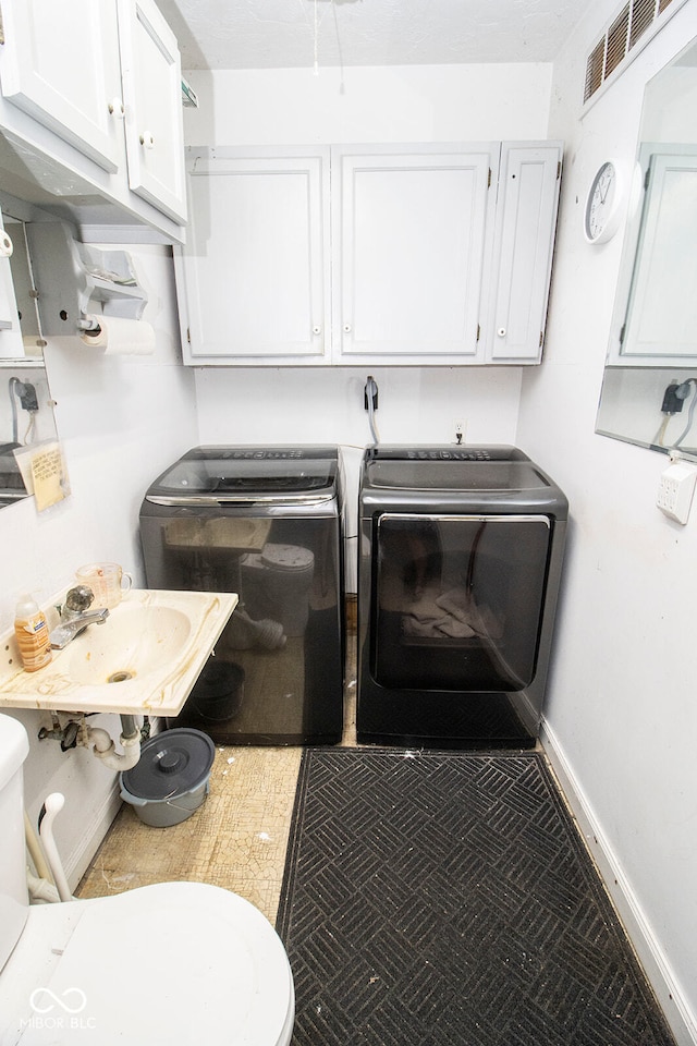 laundry room featuring sink and washing machine and clothes dryer