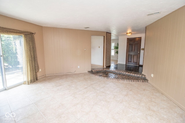 interior space featuring wooden walls