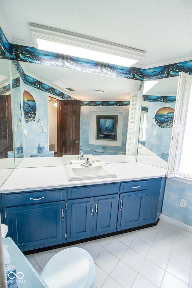 bathroom featuring vanity, toilet, and tile patterned floors