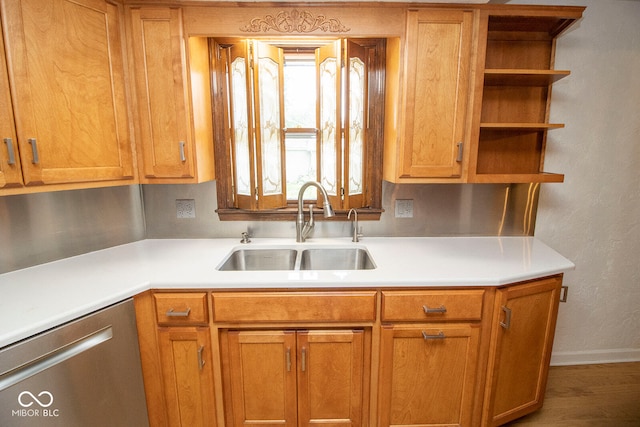 kitchen featuring sink, dishwasher, hardwood / wood-style flooring, and a healthy amount of sunlight