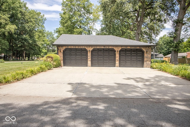 garage with a lawn