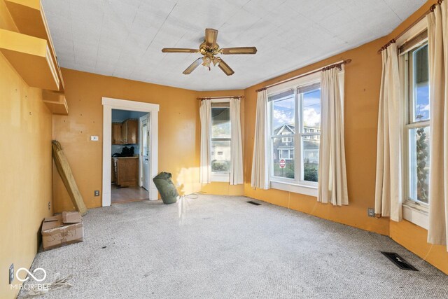 917 S 15th St, New Castle, IN 47362 - empty room featuring visible vents, ceiling fan, and carpet floors