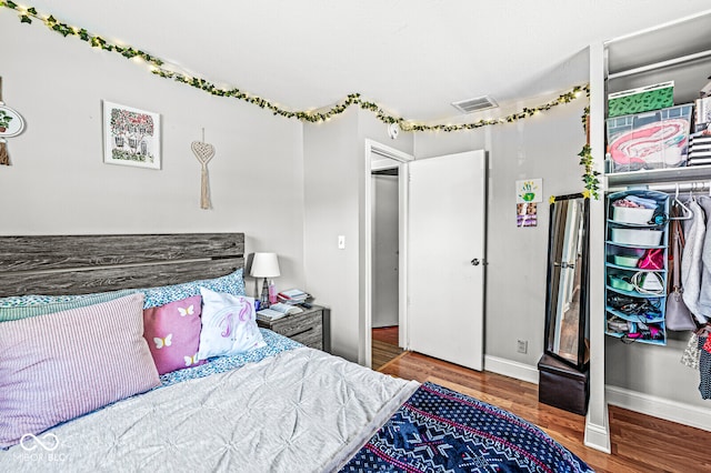 bedroom featuring hardwood / wood-style flooring