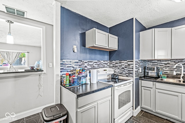 kitchen featuring decorative backsplash, a textured ceiling, white electric range oven, decorative light fixtures, and sink