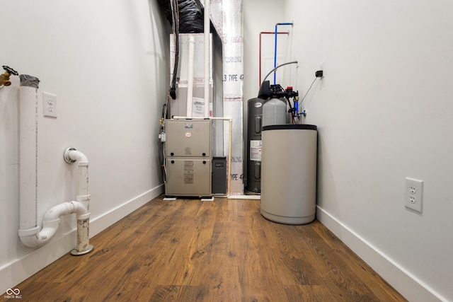 utility room featuring heating unit