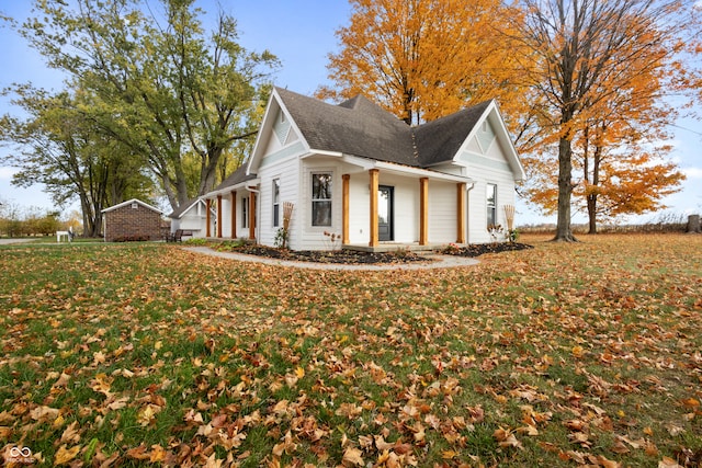 view of side of property featuring a yard