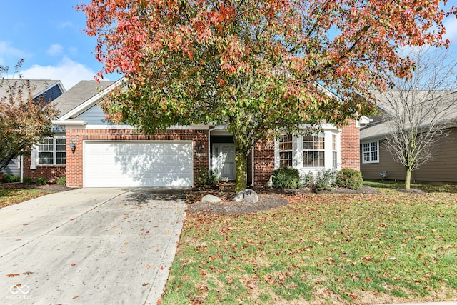 obstructed view of property with a garage and a front lawn