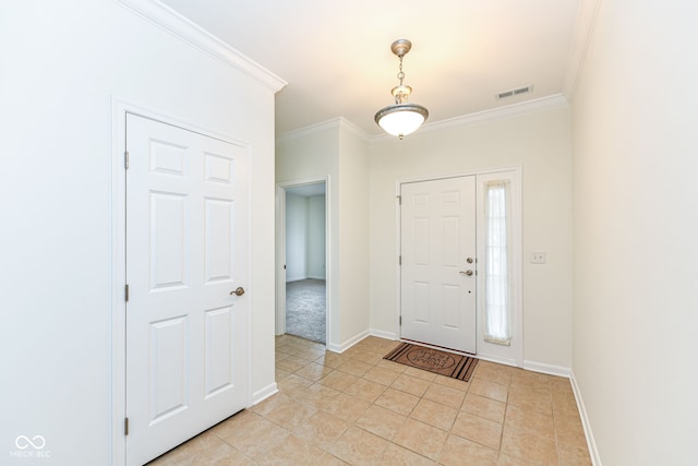 foyer with light tile patterned flooring and ornamental molding