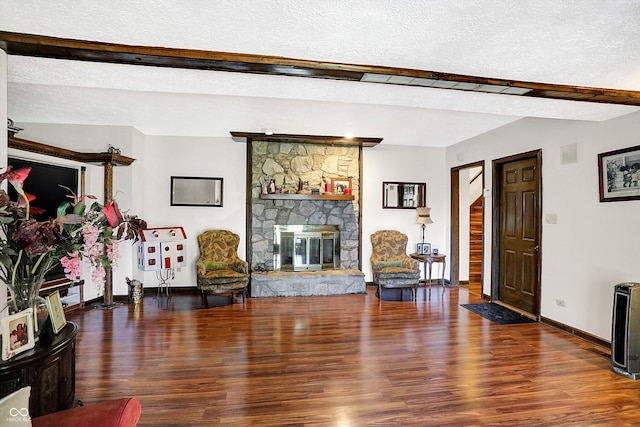 8530 Helmsman Cir, Indianapolis, IN 46256 - living area with wood finished floors, a textured ceiling, and a stone fireplace