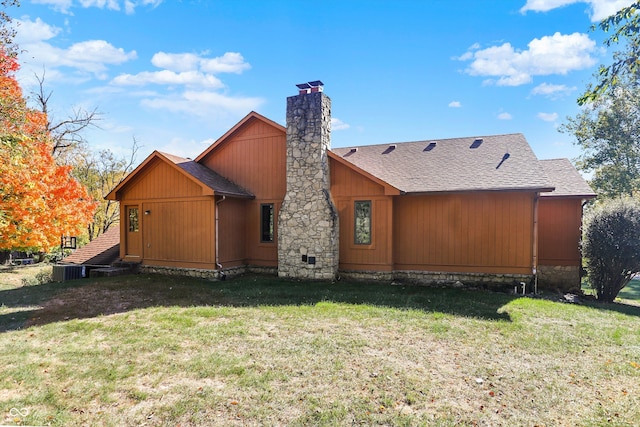 8530 Helmsman Cir, Indianapolis, IN 46256 - rear view of property featuring a yard, a chimney, and a shingled roof