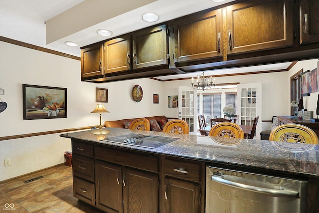 8530 Helmsman Cir, Indianapolis, IN 46256 - kitchen with stainless steel dishwasher, black electric cooktop, crown molding, a chandelier, and dark stone counters
