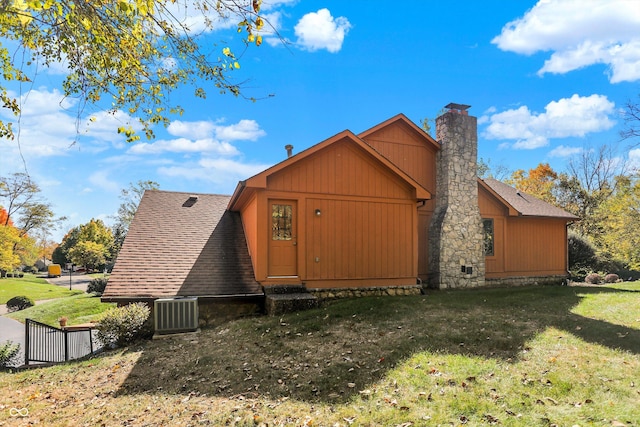 8530 Helmsman Cir, Indianapolis, IN 46256 - view of side of home with a lawn, a chimney, and roof with shingles
