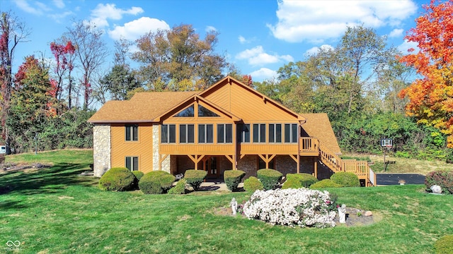 8530 Helmsman Cir, Indianapolis, IN 46256 - back of property with stone siding, a sunroom, a lawn, and stairway