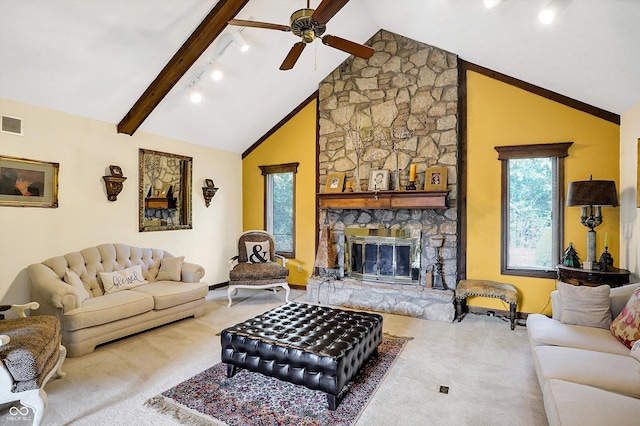 8530 Helmsman Cir, Indianapolis, IN 46256 - carpeted living room featuring plenty of natural light, a ceiling fan, a stone fireplace, and rail lighting