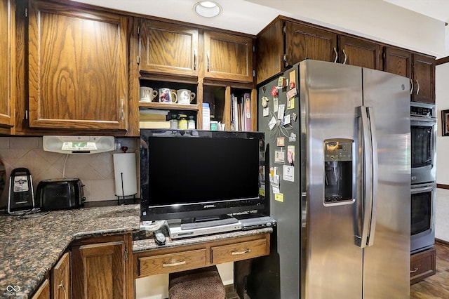 8530 Helmsman Cir, Indianapolis, IN 46256 - kitchen with stainless steel appliances, backsplash, and dark stone countertops