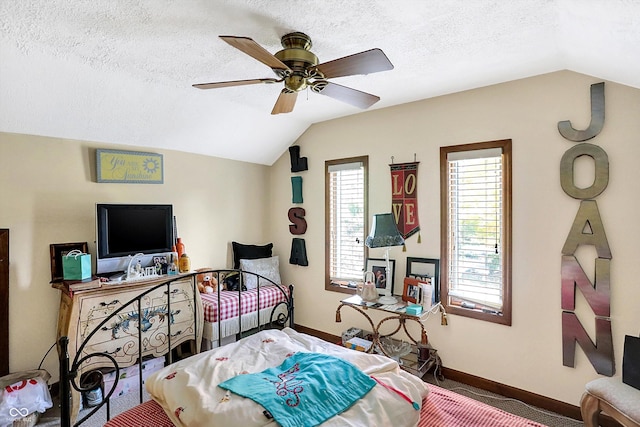 8530 Helmsman Cir, Indianapolis, IN 46256 - bedroom featuring vaulted ceiling, a ceiling fan, carpet floors, and a textured ceiling