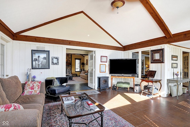 8530 Helmsman Cir, Indianapolis, IN 46256 - living room with high vaulted ceiling, wood finished floors, a wood stove, and beam ceiling