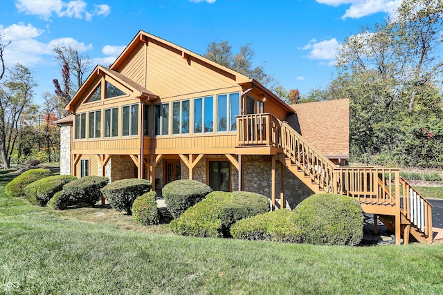 8530 Helmsman Cir, Indianapolis, IN 46256 - back of house featuring stone siding, stairs, a sunroom, a wooden deck, and roof with shingles